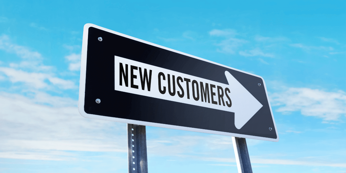 Sign with an arrow that says new customers
